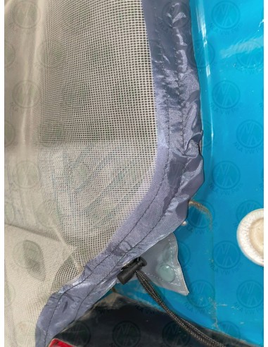 Mosquito net with grey fabric trim and combined poppers and drawstring connection to the tailgate